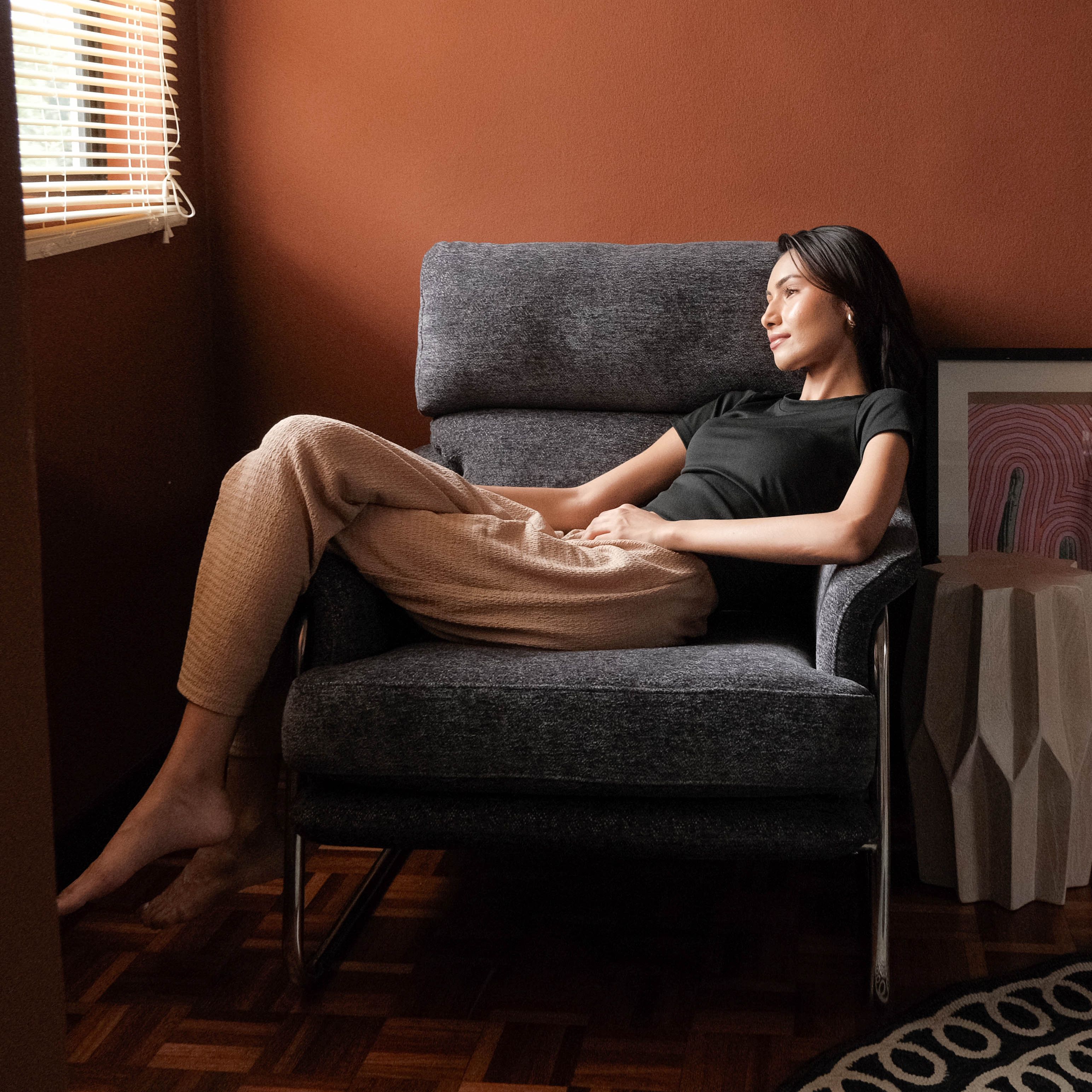 Grey fabric lounge chair for a cosy reading corner in Malaysian and Singaporean homes